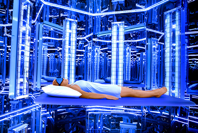 Lady relaxing and enjoying a Blu Room session at Into The Blu Burlington